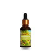 Single lemongrass essential oil bottle with fresh lemongrass stalks.